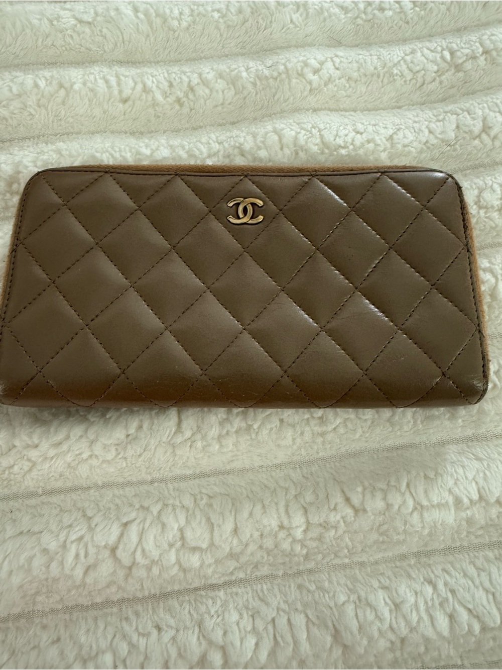 CHANEL Quilted Leather Zip Wallet in Brown with Gold CC